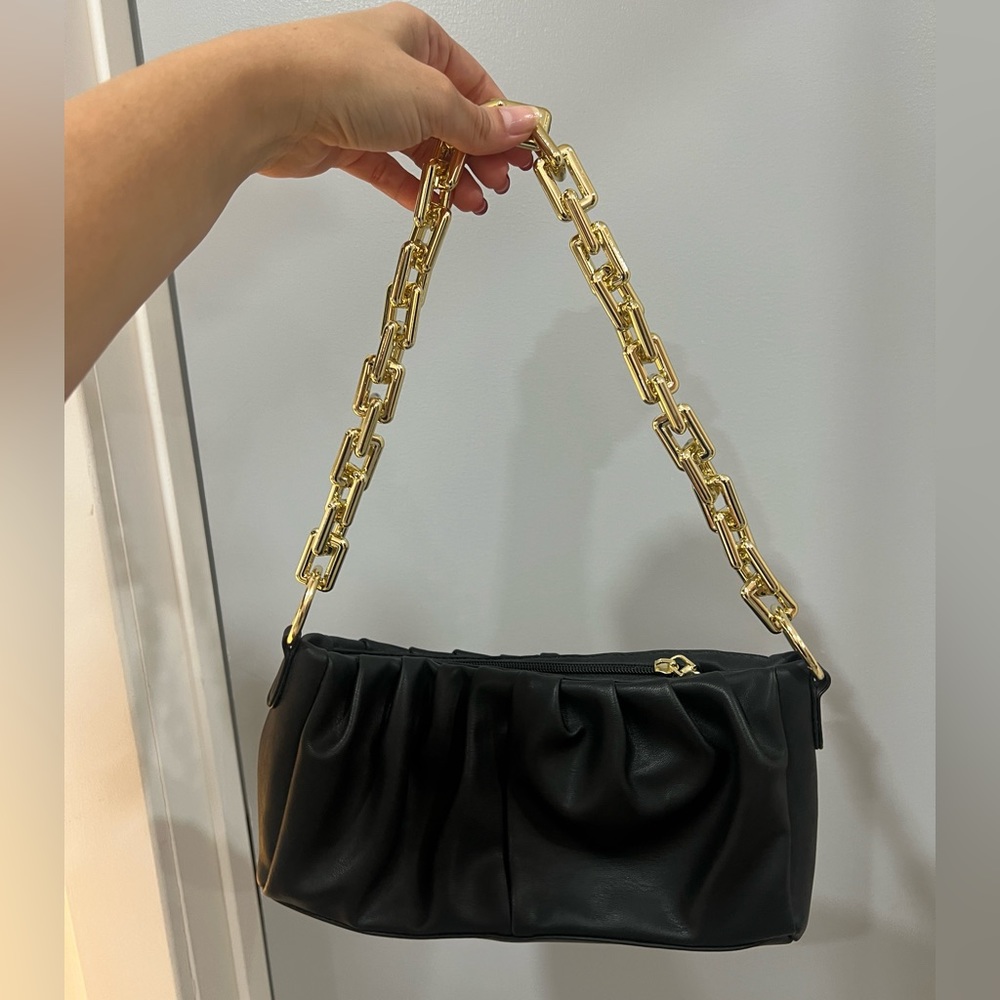 Black bag with gold chain strap